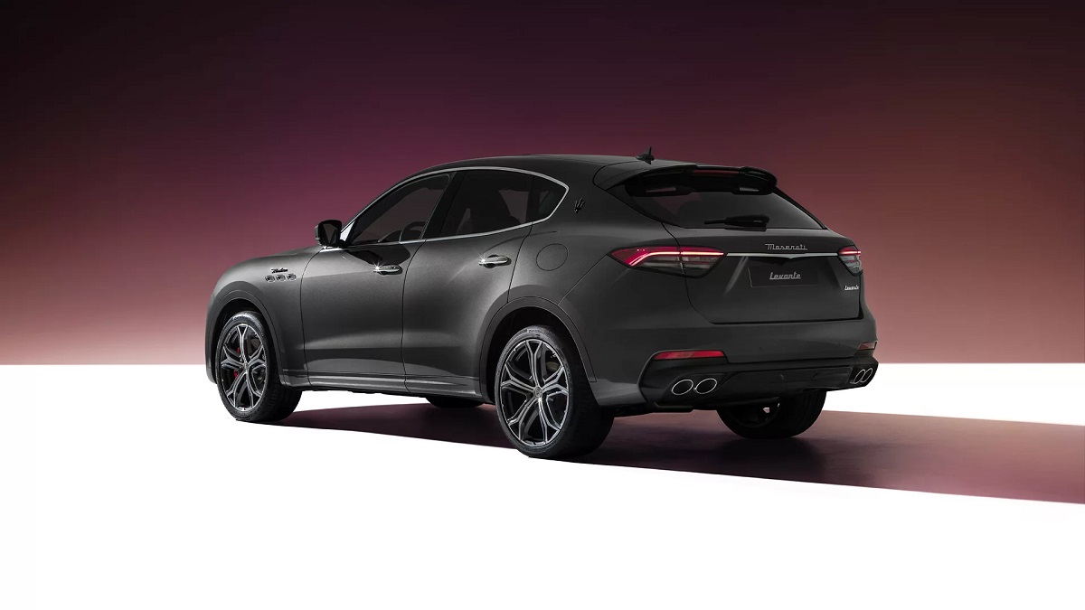 A gray 2022 Maserati Levante against a maroon background.