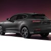 A gray 2022 Maserati Levante against a maroon background.