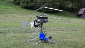 A Microhelicopter SCH-2A, the cheapest helicopter in the world, sitting in a field