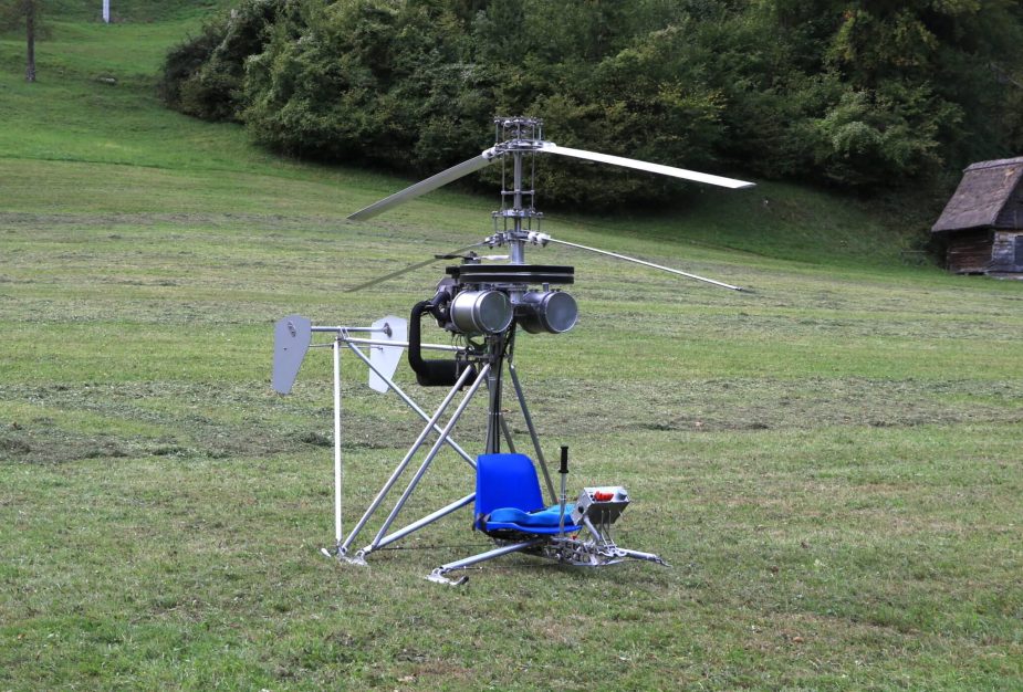 A Microhelicopter SCH-2A, the cheapest helicopter in the world, sitting in a field