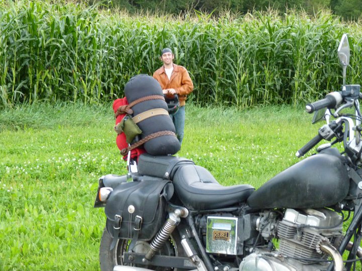 The author on a motorcycle trip, a bedroll tied to the back of his bike.