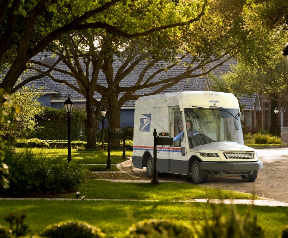 The new USPS mail truck delivers mail in a local neighborhood. 