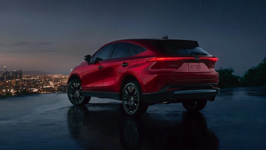 Rear angle view of Ruby Flare Pearl 2023 Toyota Venza crossover SUV