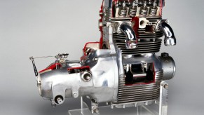 Cutaway engine with its camshafts and valves visible.