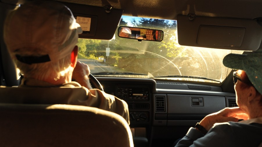 Sunset and man and woman in car, highlighting how a car is best place for difficult conversatations
