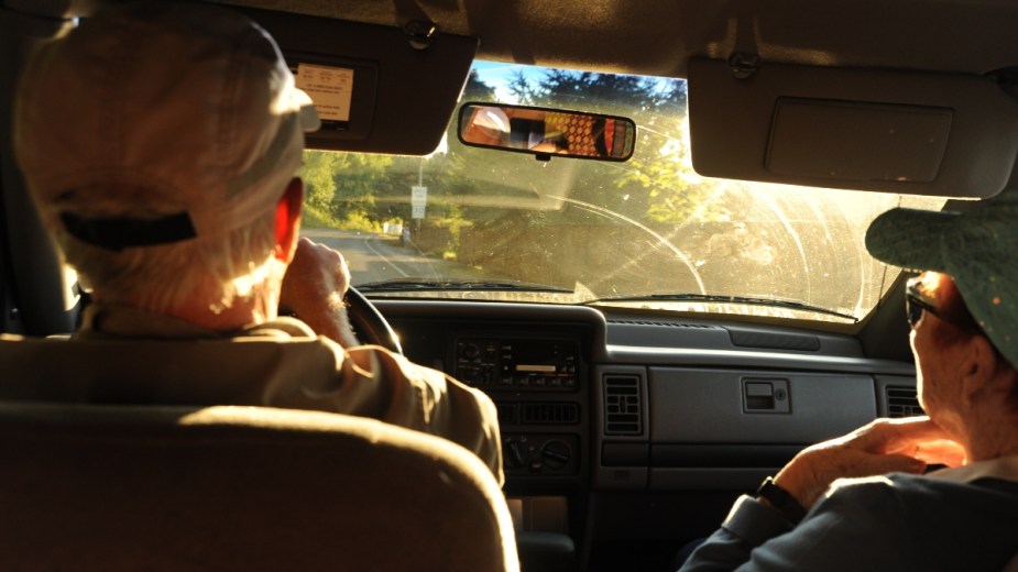 Sunset and man and a woman in car, highlighting how a car is best place for difficult conversatations