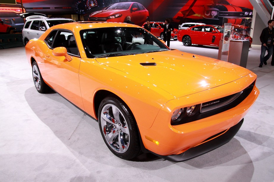 An orange 2012 Dodge Challenger on stage at the 2012 Chicago Auto Show