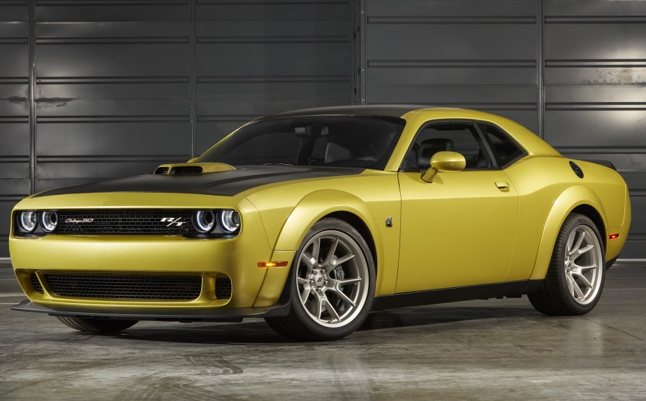 A gold 2020 Dodge R/T Scat Pack Widebody 50th Anniversary Edition with a black Shaker Hood in a garage