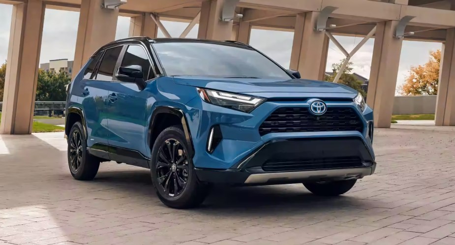 A blue 2022 Toyota RAV4 Hybrid small hybrid SUV is parked.