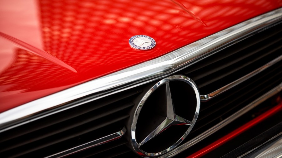 A bright red Mercedes-Benz 560SL like Donald Trump's shows off its handsome front end.