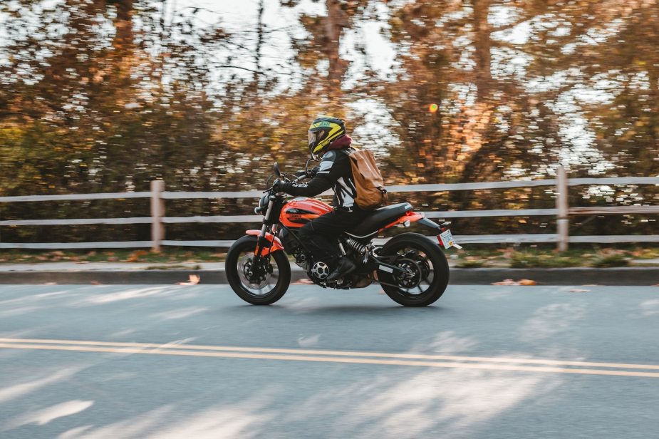 An ultralight Harley-Davidson rider road trips with only a backpack.