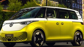 A green Volkswagen ID. Buzz is parked.