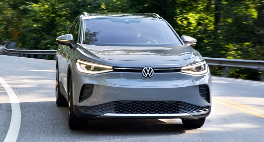 A gray 2022 Volkswagen ID.4 is driving on the road. 
