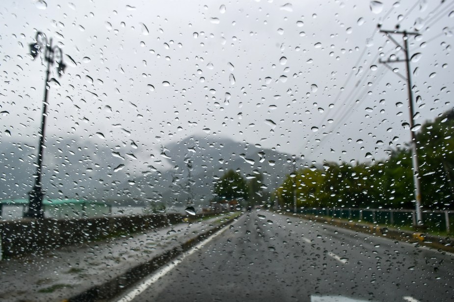 A windshield with potentially having wipers having issues when trying to get rid of water drops.