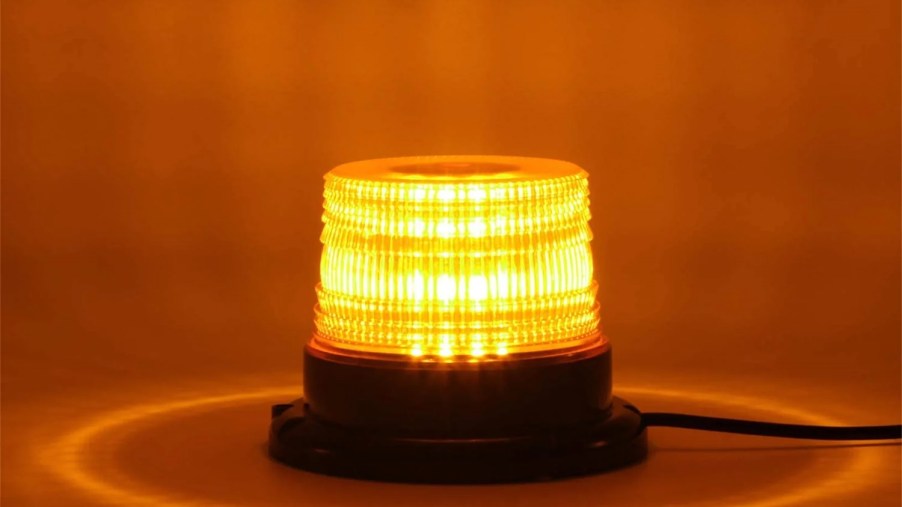 Product photo of a flashing yellow or amber emergency light.