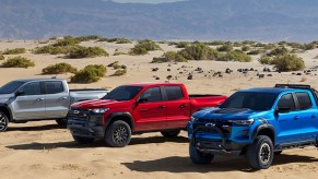 a trio of 2023 Chevy Colorado trucks in the desert
