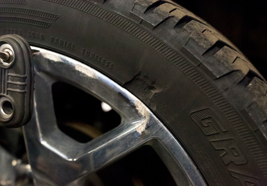 A damaged tire in need of an alignment. Is replacing one tire OK?