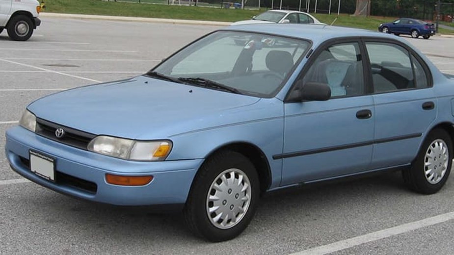 Blue 1995 Toyota Corolla parked