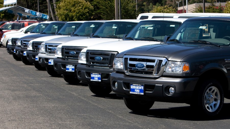 A group of 2011 Ford Ranger trucks sit on a dealership lot.