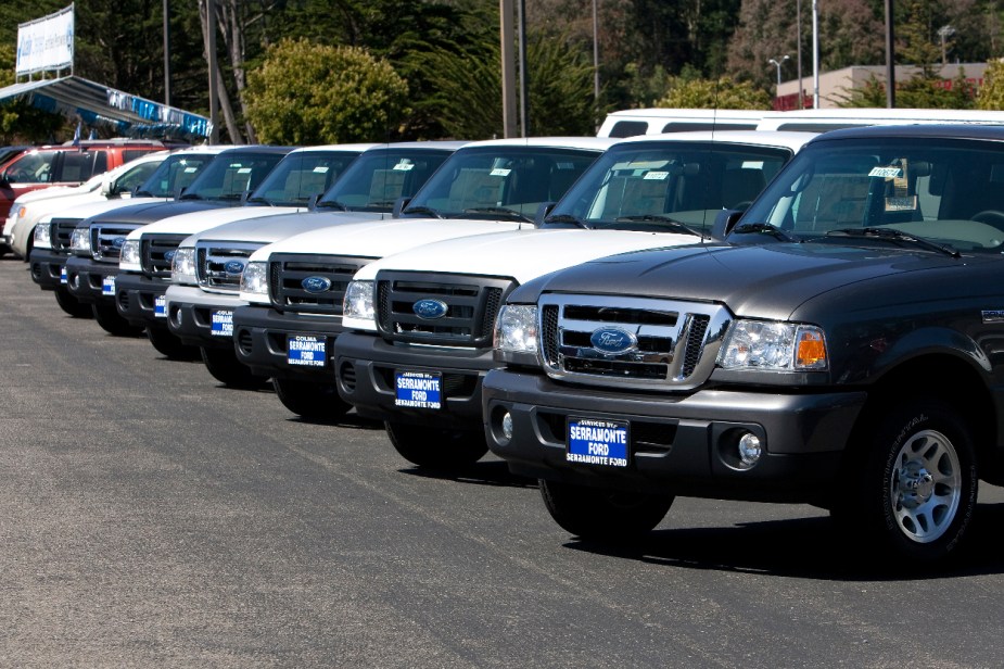 A group of 2011 Ford Ranger trucks sit on a dealership lot.