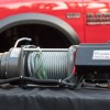 Promotional photo of a Warn winch in front of the Ram 2500 power wagon pickup truck you can order it on.