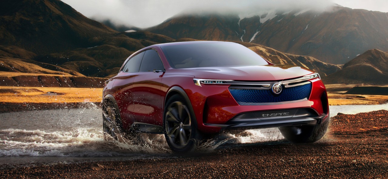 a red Buick Enspire crossover in water.