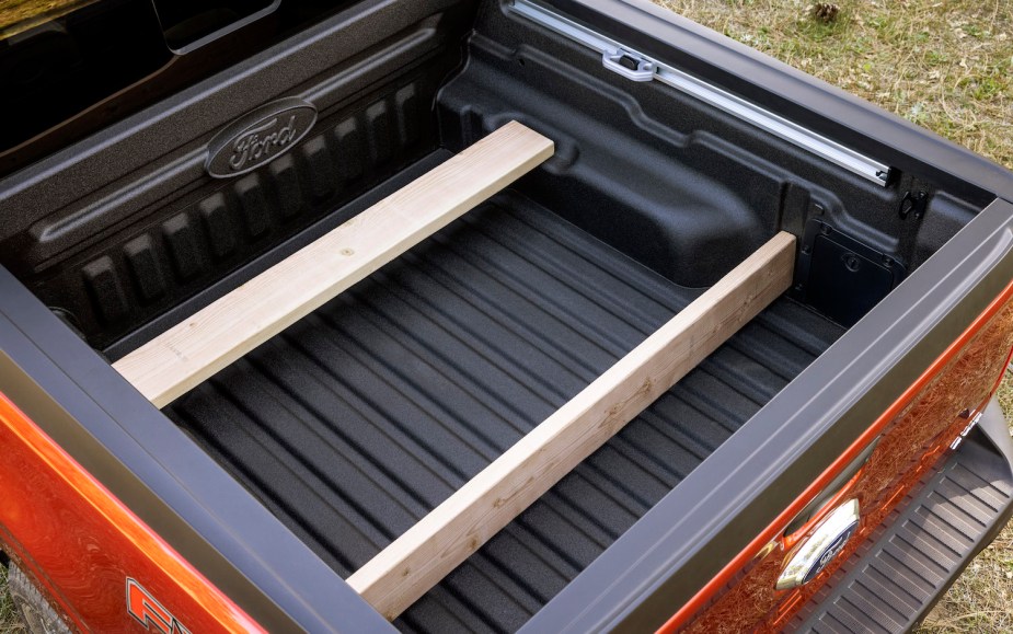 Ford Maverick pickup truck showing its Flexbed capabilities with pieces of lumber cut to be bed dividers.
