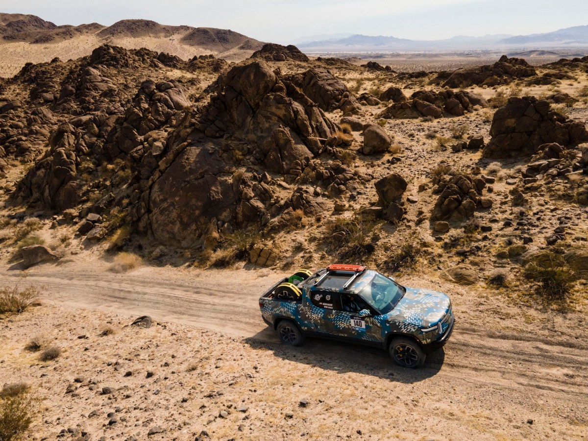 A Rivian R1T truck competing in an off-road rally. 