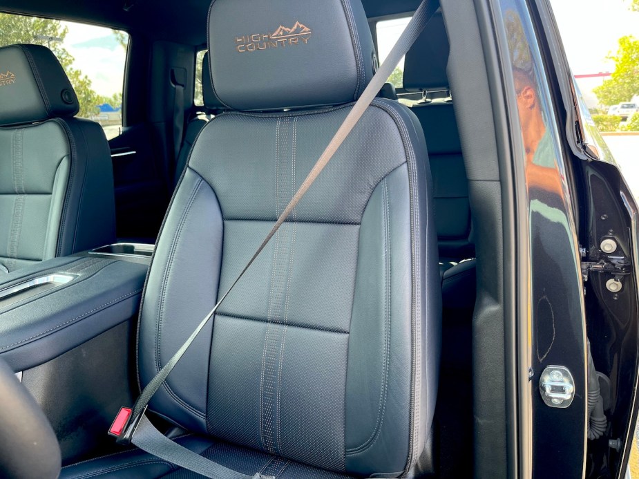 The driver's side front seat and seat belt on the 2022 Chevrolet Silverado High Country.