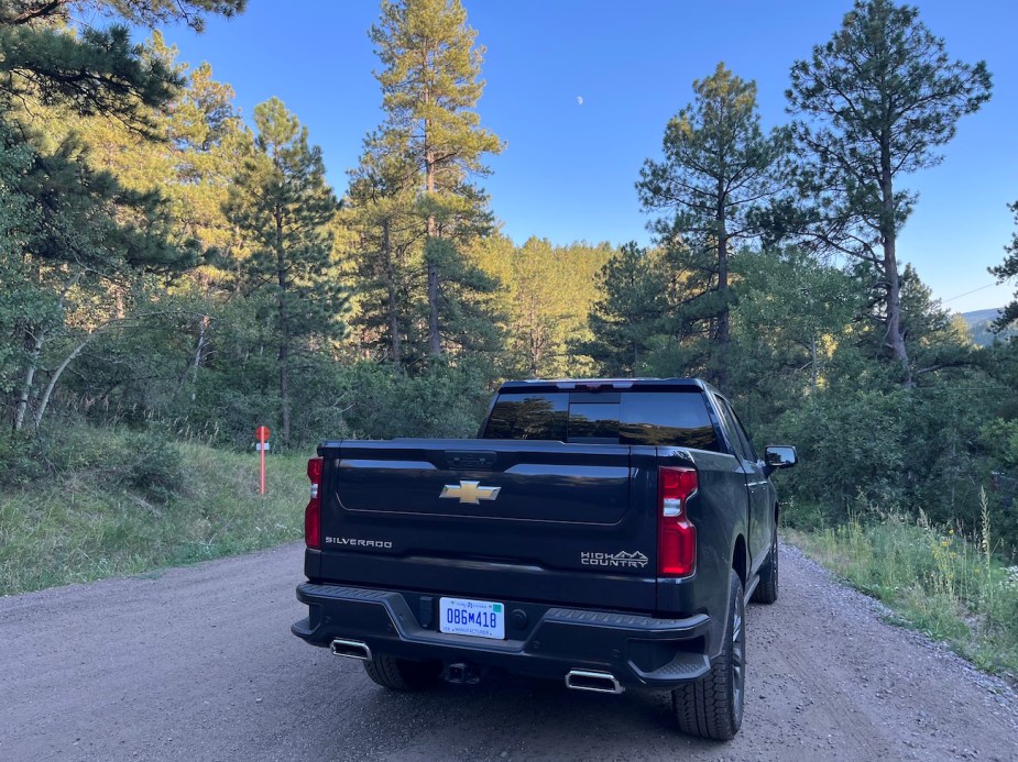 Rear view of the 2022 Silverado in the forest.