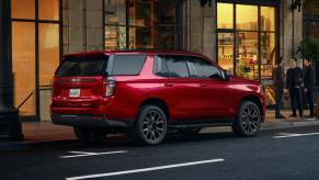 A red 2022 Chevy Tahoe RST parked on the street. Experts recommend it over the most popular trim.