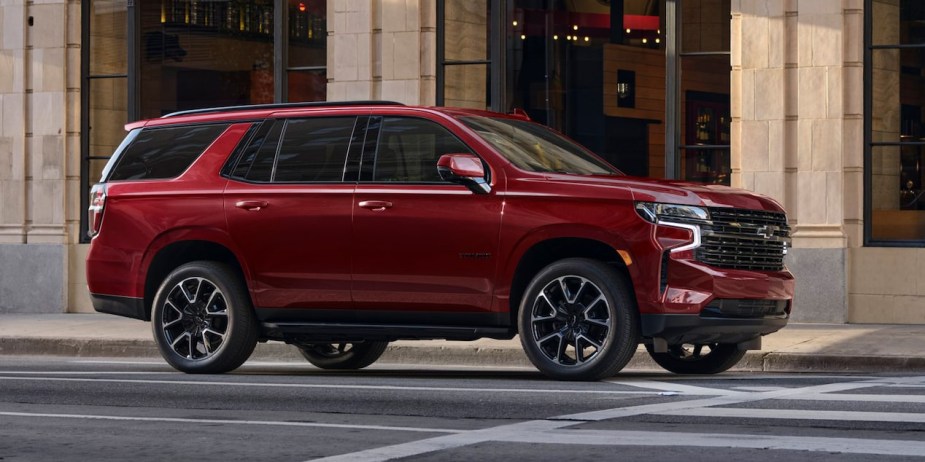 A red 2022 Chevy Tahoe. Why do experts disagree about the best trim for the full-size SUV?