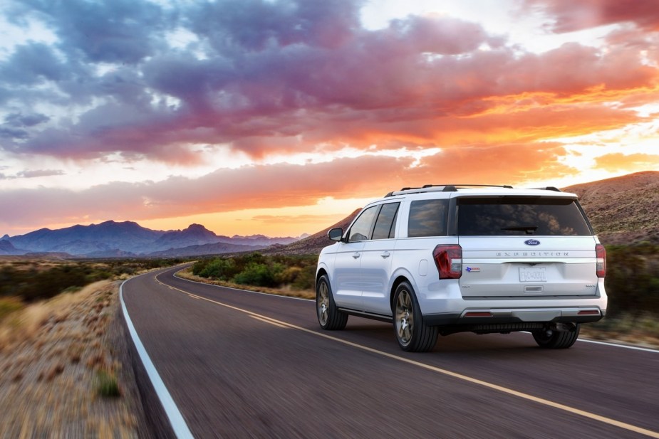 2022 Ford Expedition in white driving. There's 1 reason the Platinum trim is worth the upgrade.