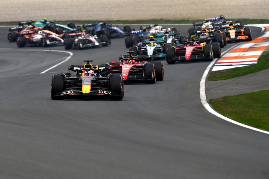 Max Verstapen leads the Formula 1 pack during the 2022 Netherlands Grand Prix in his Red Bull Racing car.