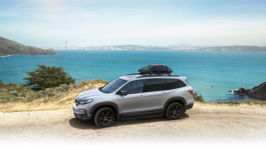 A 2022 Honda Pilot parked on the beach. It's the only Honda SUV that's actually better cheaper.