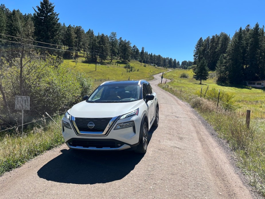 The 2022 Nissan Rogue on a gravel road.