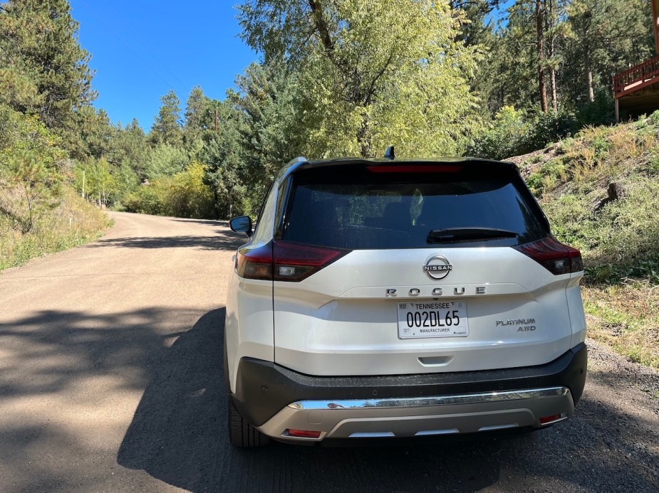 Rear view of a 2022 Rogue on a dirt road.