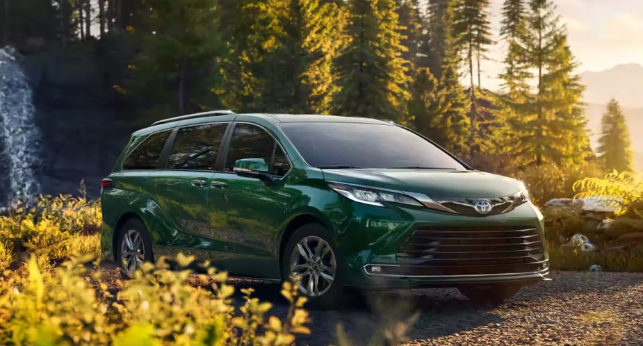 A green 2022 Toyota Sienna minivan is parked outdoors. 