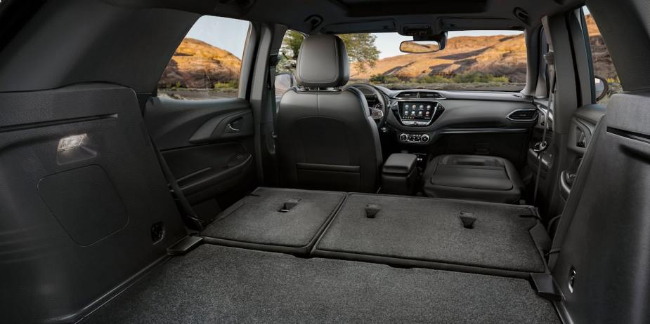An interior shot of a 2023 Chevy Trailblazer with the second row of seats folded down for more cargo space
