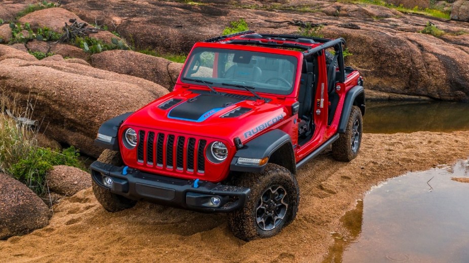 Red 2023 Jeep Wrangler 4xe posed on the trails