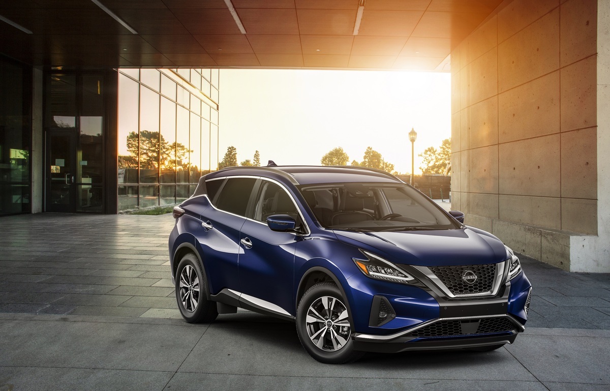 A blue 2023 Nissan Murano parked in a partial outdoor environment.