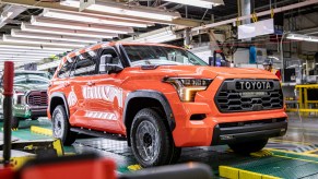 An orange Toyota Sequoia on the production line in Texas