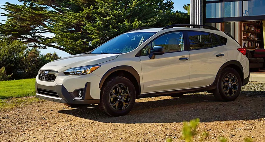A white 2023 Subaru Crosstrek is parked outdoors.