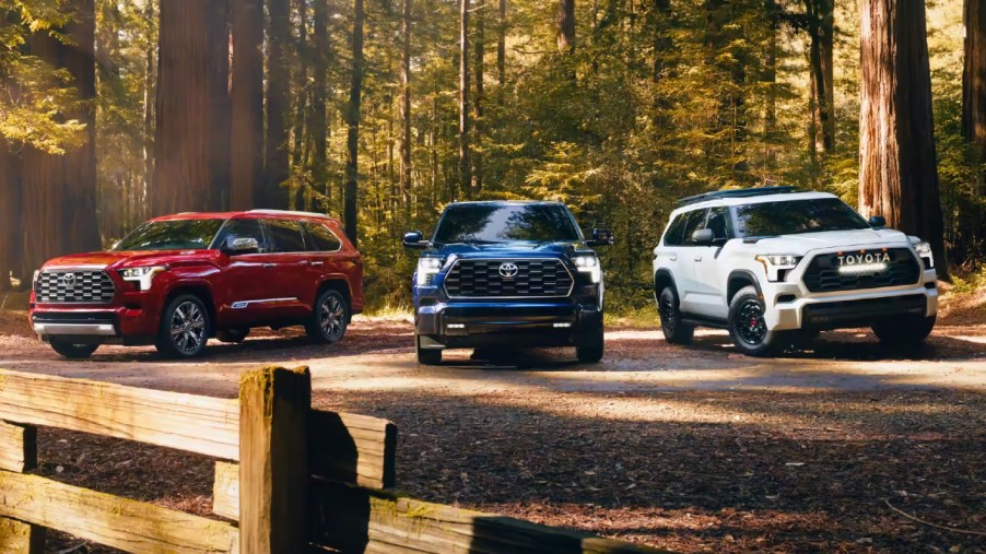 Three Toyota Sequoia full-size SUVs are parked.