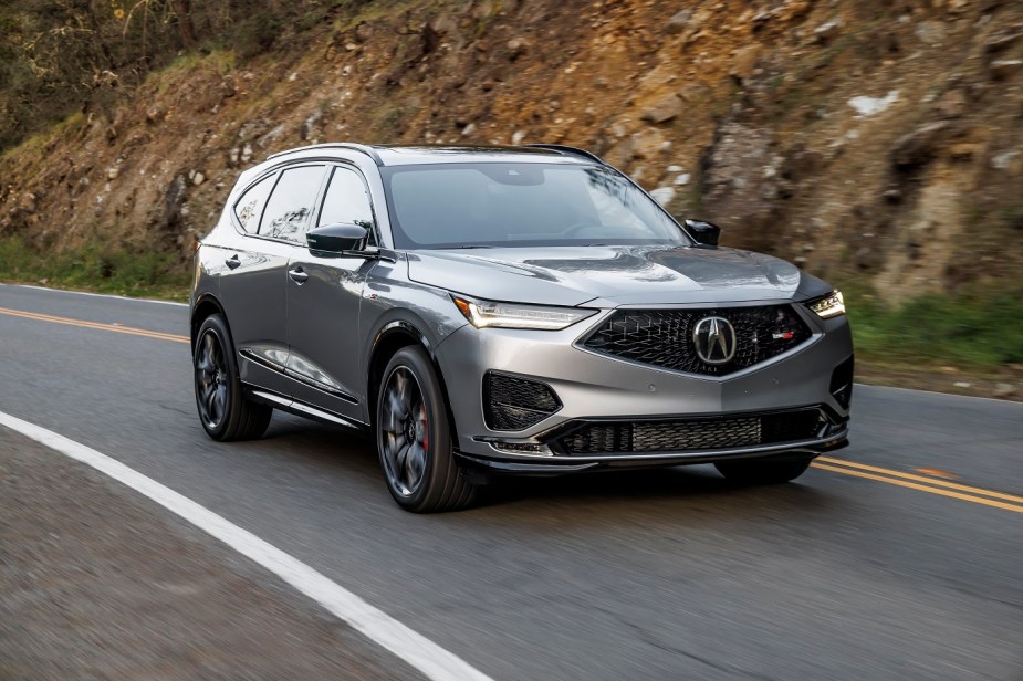 2022 Acura MDX in silver on a road is the most reliable Acura SUV. 