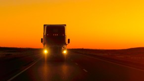 A Semi-Truck on the Road at Dawn