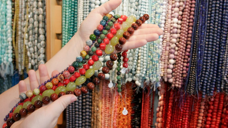 A group of beads, similar to those used to make car beads, which was a car accessory made popular by cab drivers.