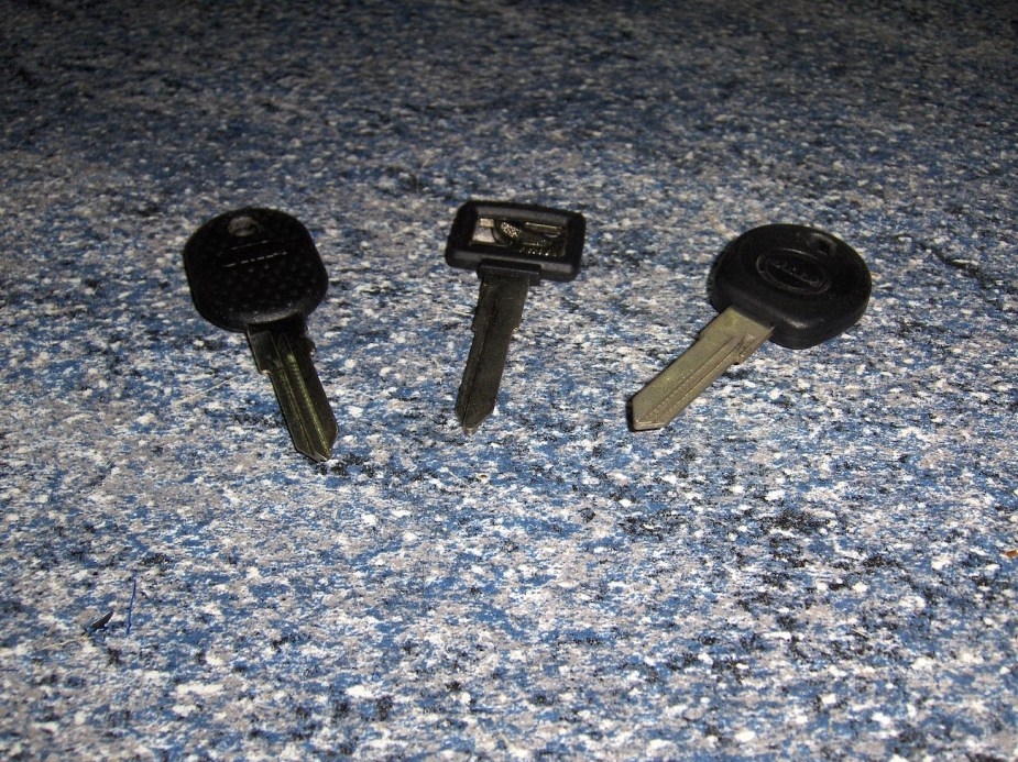 Car keys next to a valet key