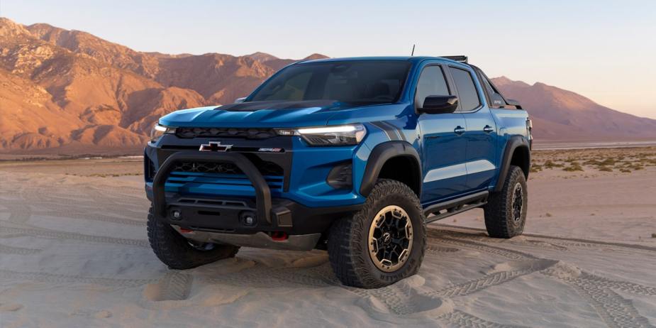 A blue 2023 Chevy Colorado mid-size truck has a seriously aggressive look.