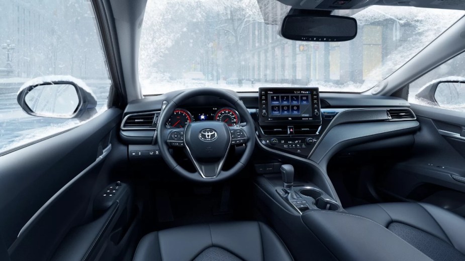 Dashboard and front seats in new 2023 Toyota Camry midsize sedan, highlighting how much a fully loaded one costs
